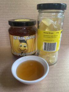 Jars of honey and honey drops.